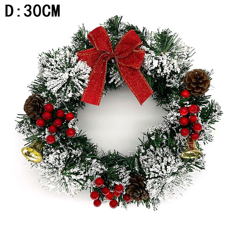 Festive Christmas wreath with red bow, pinecones, gold bells, frosted branches, and red berries, measuring 30cm in diameter.