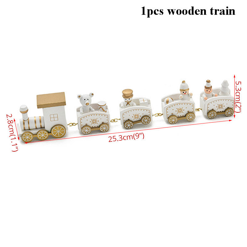 Wooden toy train with gold accents features five connected cars, including a locomotive, bear, and passengers. Dimensions are labeled, train is white and gold, 25.3 cm (9 inches) long.