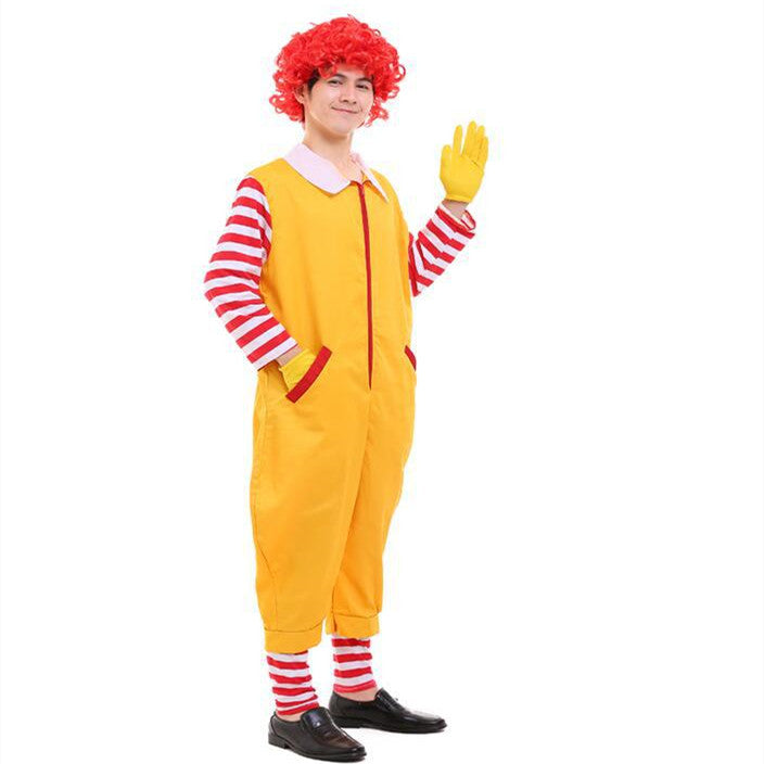 Person in a clown costume with a red wig, yellow jumpsuit, red and white striped sleeves, and gloves, waving and smiling. White background.