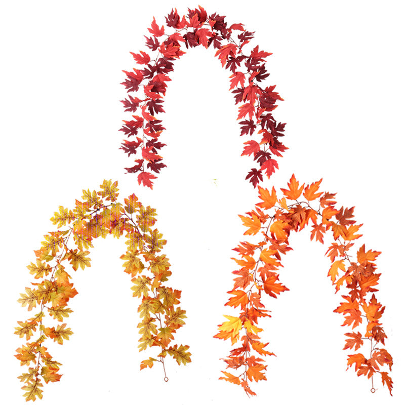 Three garlands of autumn leaves in red, orange, and yellow hues form arches against a white background, symbolizing the vibrant colors of fall foliage.
