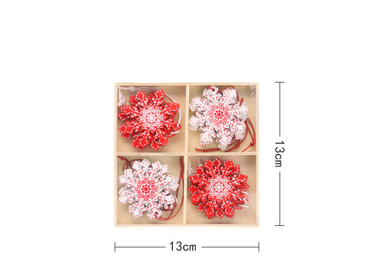 A set of four red and white snowflake-shaped ornaments in a 13cm square box, featuring intricate patterns. Two ornaments are primarily red, and two are predominantly white.