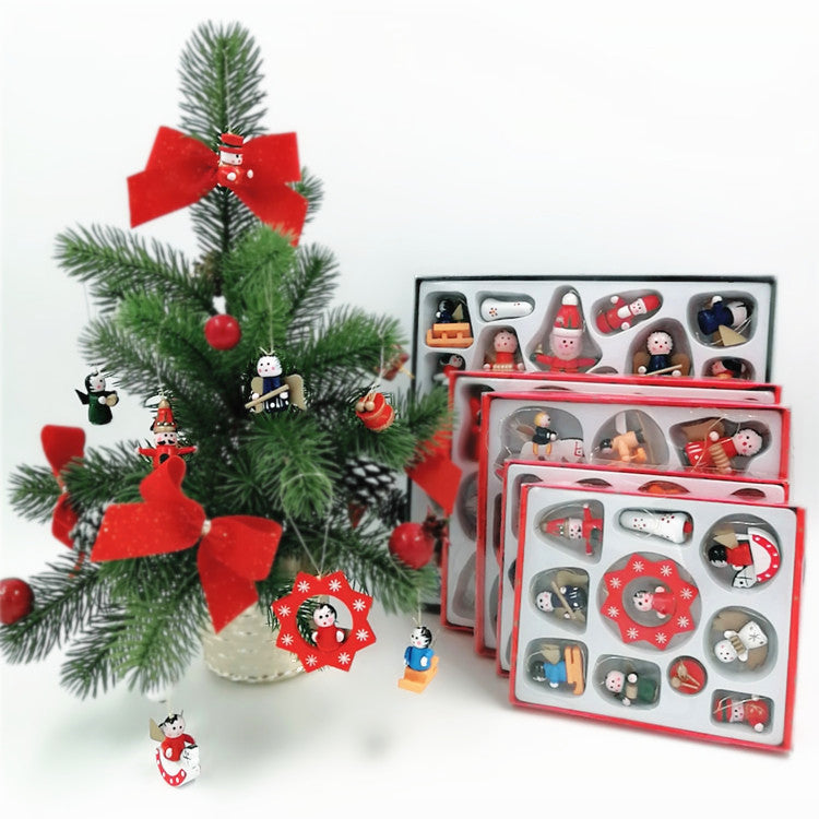 Small Christmas tree with red bows and colorful wooden ornaments displayed. Nearby, several boxes showcase similar ornaments for decoration.