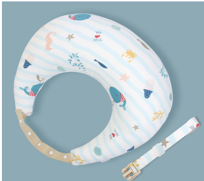 Infant neck pillow with a sea theme, featuring whales, starfish, jellyfish, and seashells. It includes a detachable strap with a buckle. The background is soft blue.