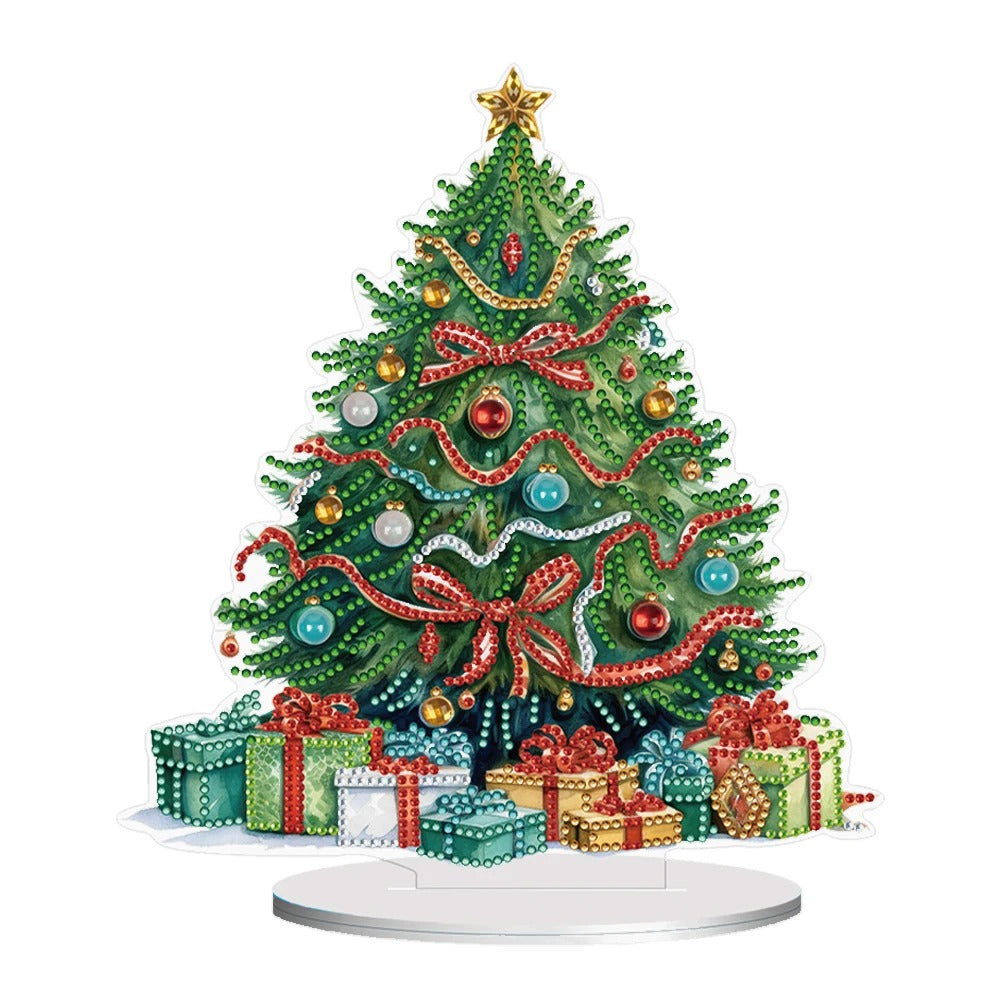 Festive Christmas tree adorned with colorful ornaments, ribbons, and a star topper. Presents wrapped in varied paper and bows sit at the base on a white background.