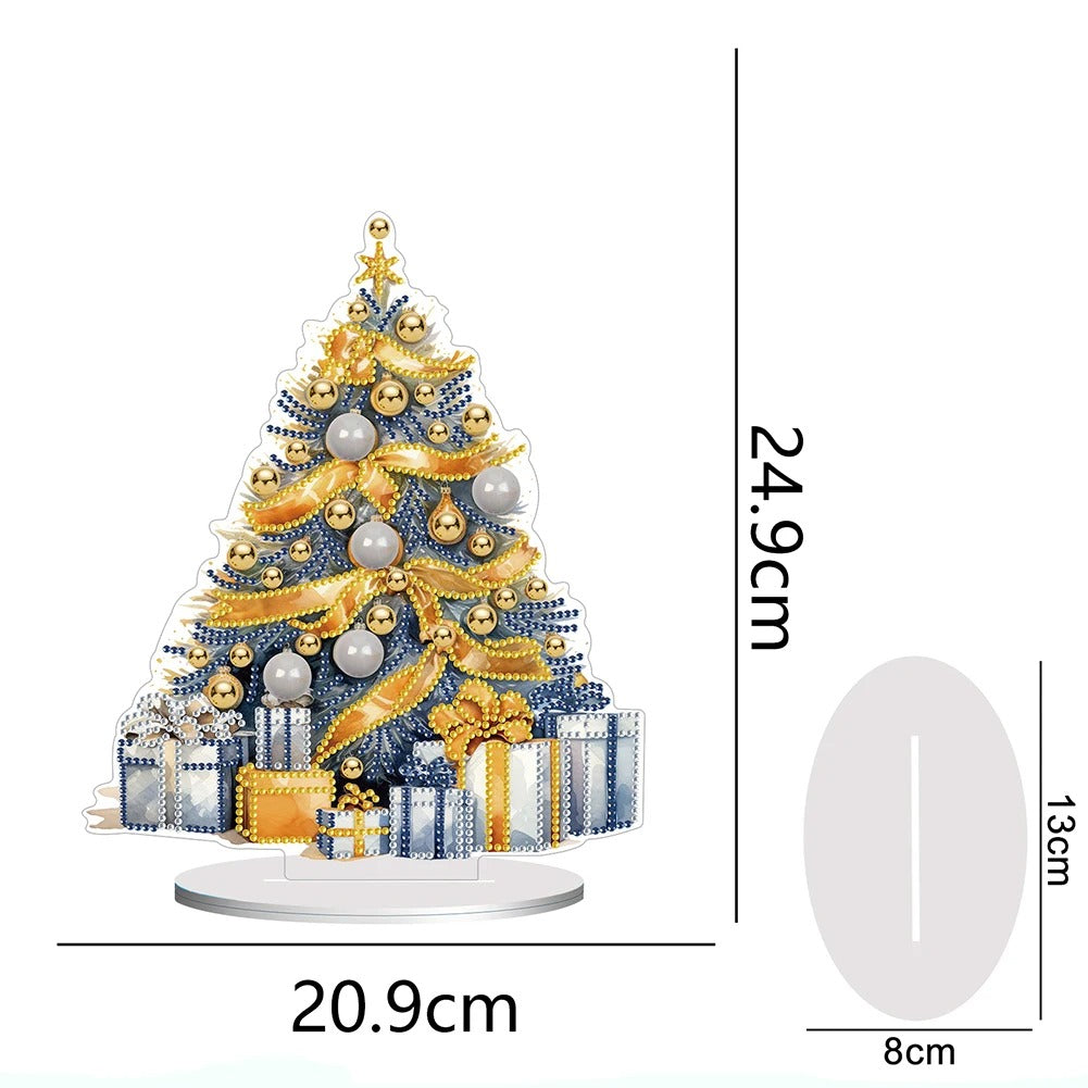 Decorative Christmas tree with gold and silver ornaments and gifts at the base. Dimensions: 24.9cm height, 20.9cm width, base 13cm by 8cm.