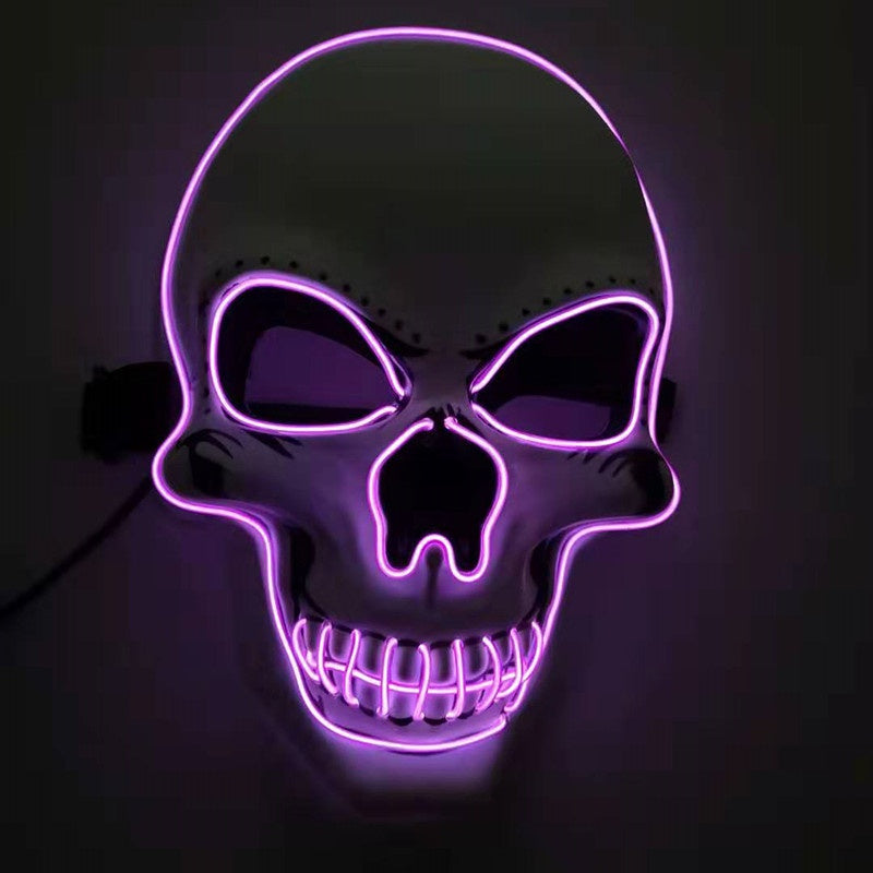 A glowing purple neon skull with hollow eyes and detailed teeth design, set against a dark background, creating an eerie and striking visual effect.
