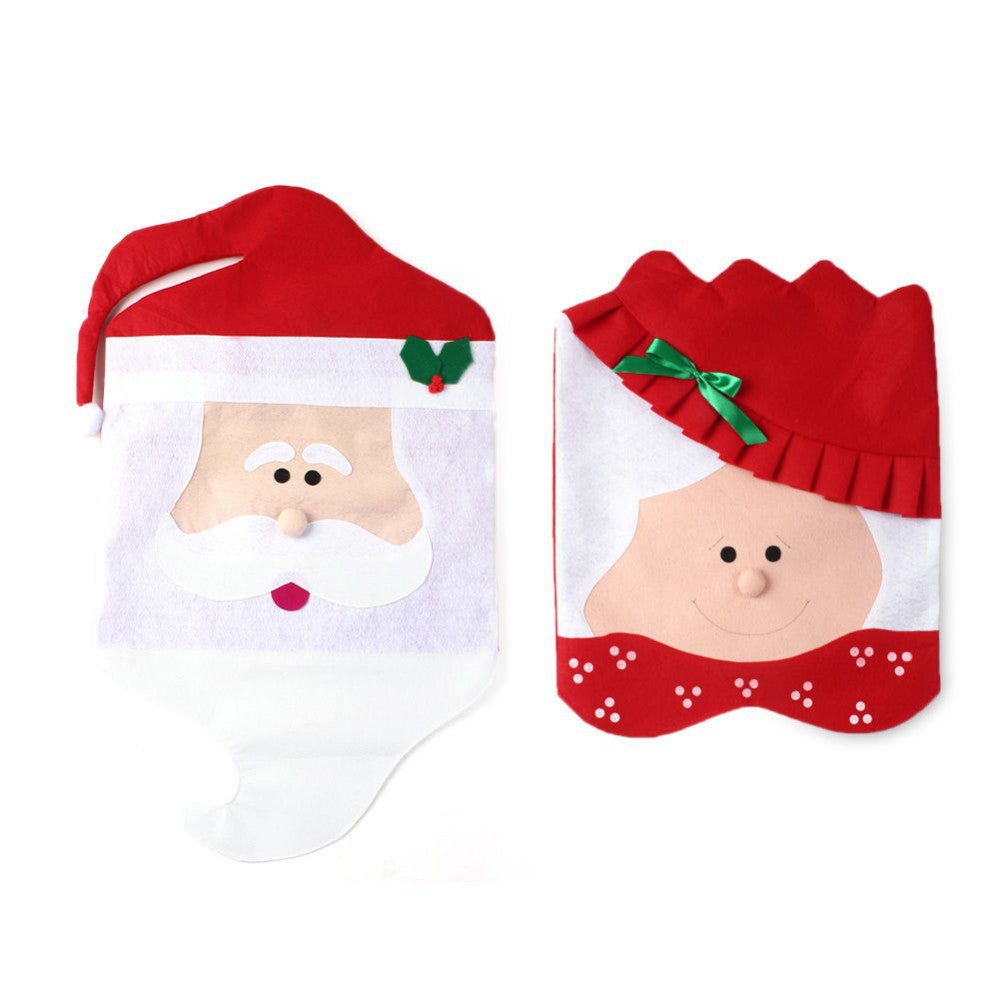 Festive chair covers featuring Santa and Mrs. Claus. Santa's cover has a red hat with holly, and Mrs. Claus's cover has a green bow and a red ruffled hat.