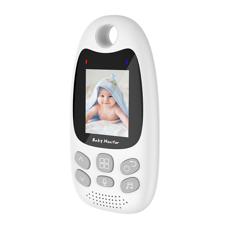 White baby monitor with a color display showing an infant in a towel. Features control buttons, microphone, music, and power icons, with a hanging loop on top.