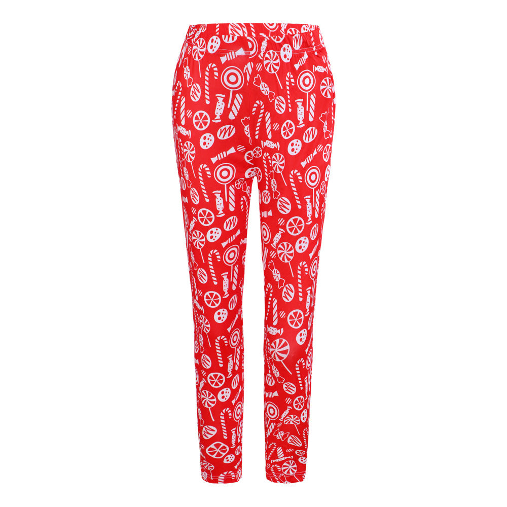 Red pajama pants with a festive white candy pattern, featuring candy canes, lollipops, and wrapped sweets. The design is vibrant and playful, ideal for holiday wear.