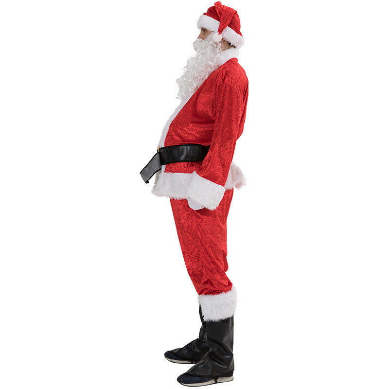 Man in Santa costume with red suit, black belt, and white trim, standing in profile. White beard, hat, and black boots complete the festive look against a plain white background.