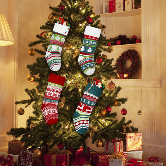Christmas tree adorned with lights, ornaments, and four colorful stockings. Presents are underneath, and a festive wreath is on the wall, creating a cozy holiday atmosphere.