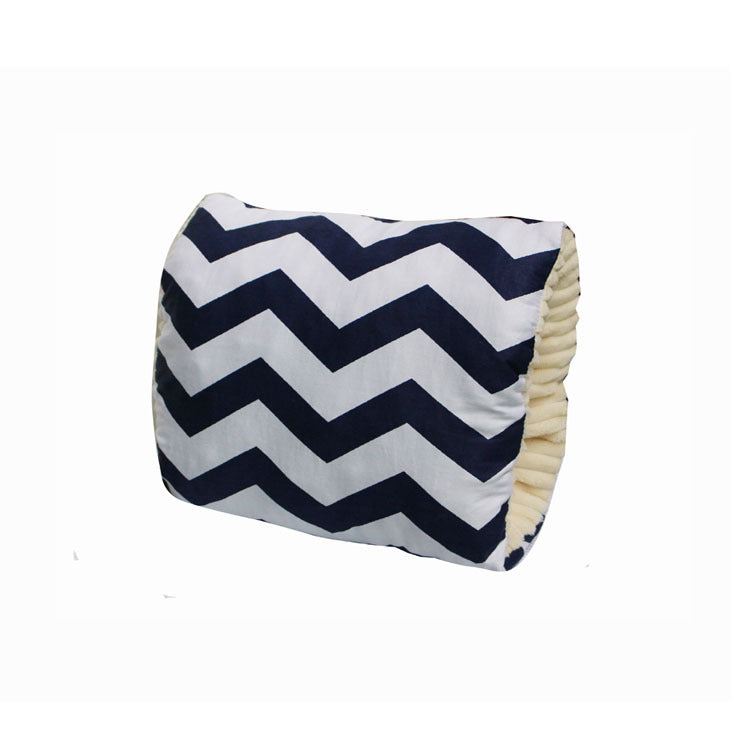 Chevron-patterned cushion with a navy and white zigzag design, featuring cream-colored, pleated sides.
