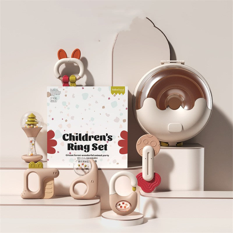 Children's Ring Set with a cream and brown animal theme. Includes a fox ring, donut-shaped toy, tree globe, and assorted playful items on a white background.