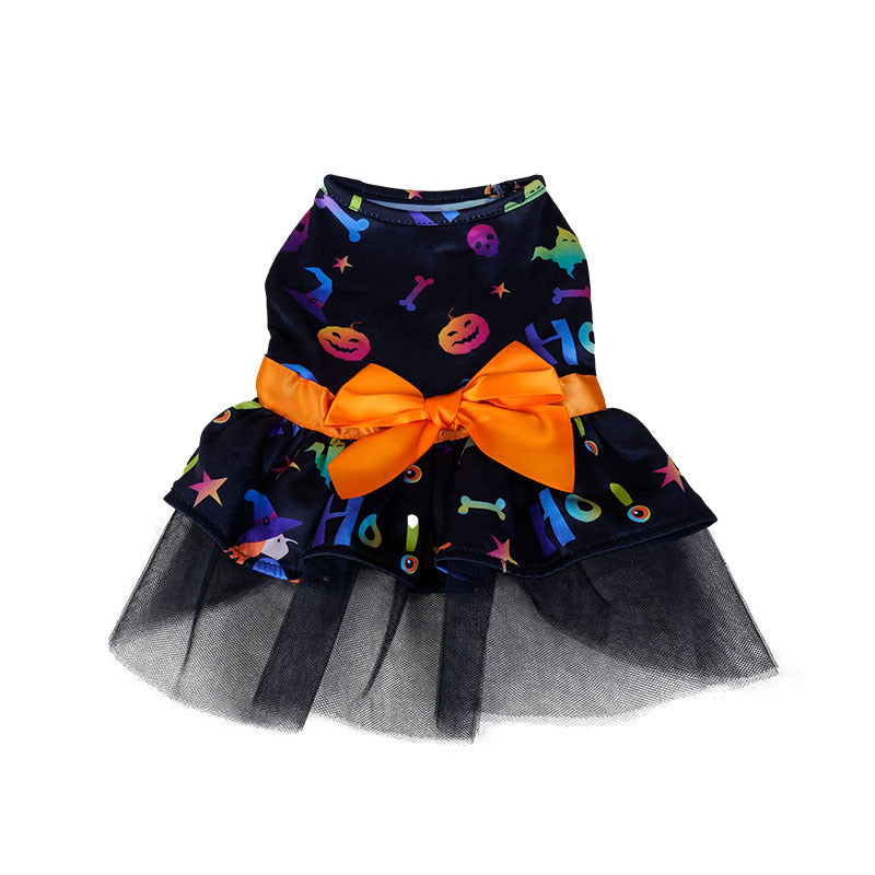 Dark pet dress with colorful Halloween patterns, featuring pumpkins and skulls, adorned with a bright orange bow at the waist and a black tulle skirt.