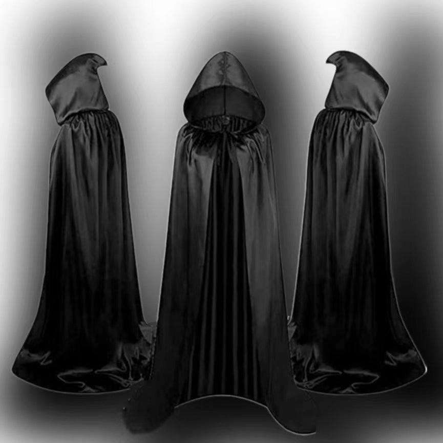 Three black hooded cloaks stand upright against a gradient background, the middle cloak facing forward, while the others face slightly outward.