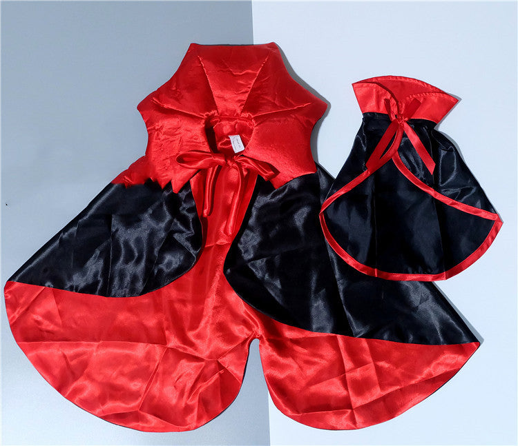 Red and black satin pet costumes with capes. The larger piece features a thick collar and bow, while the smaller one has a matching design and trim.