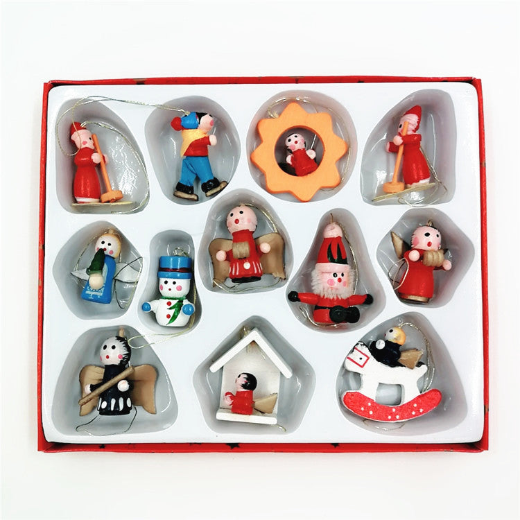A boxed set of twelve colorful, miniature wooden Christmas ornaments, including angels, a snowman, Santa, and various festive characters, neatly arranged in individual compartments.