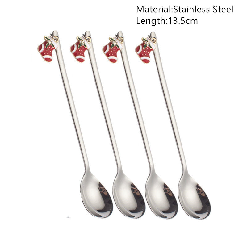 Four stainless steel spoons, each 13.5cm long, feature a small red Christmas stocking decoration on the handle.