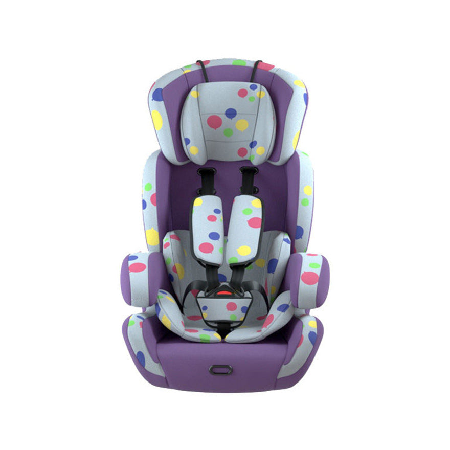 Colorful polka dot car seat with a purple base and a secure five-point harness, designed for children. The seat features bright circles in blue, yellow, pink, and green.