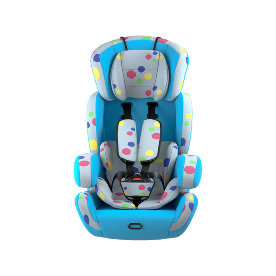 Colorful child car seat with blue and gray base, adorned with multicolored polka dots. It features padded headrest and adjustable harness straps, designed for safety and comfort.
