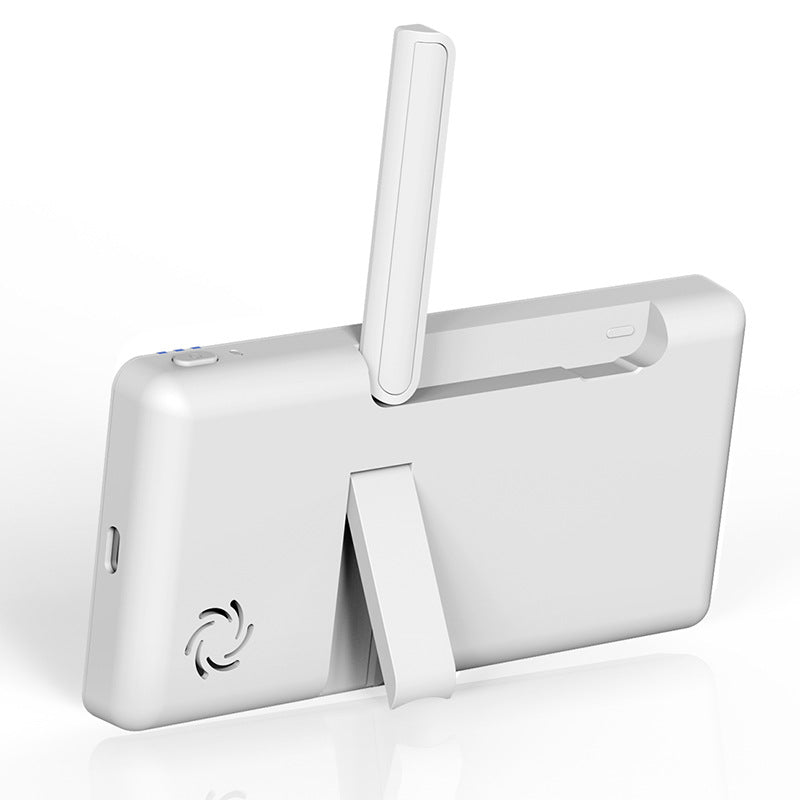 Back view of a compact, rectangular white device with an extended antenna and a fold-out stand. The device features a small ventilation fan on its casing.