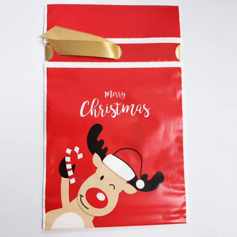 Red Christmas gift bag featuring a winking reindeer holding a candy cane, with "Merry Christmas" text above. The bag has a gold ribbon tie at the top.