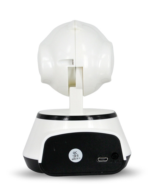 Rear view of a small, white dome-shaped security camera on a black and white base, showing connection ports and a reset button.