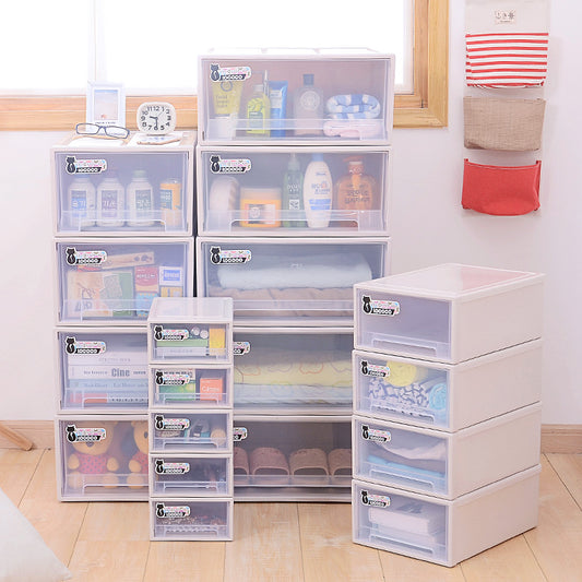 Plastic storage drawers are neatly arranged, filled with various items like toiletries, books, towels, and shoes. Some small hanging pockets on the wall hold additional items.
