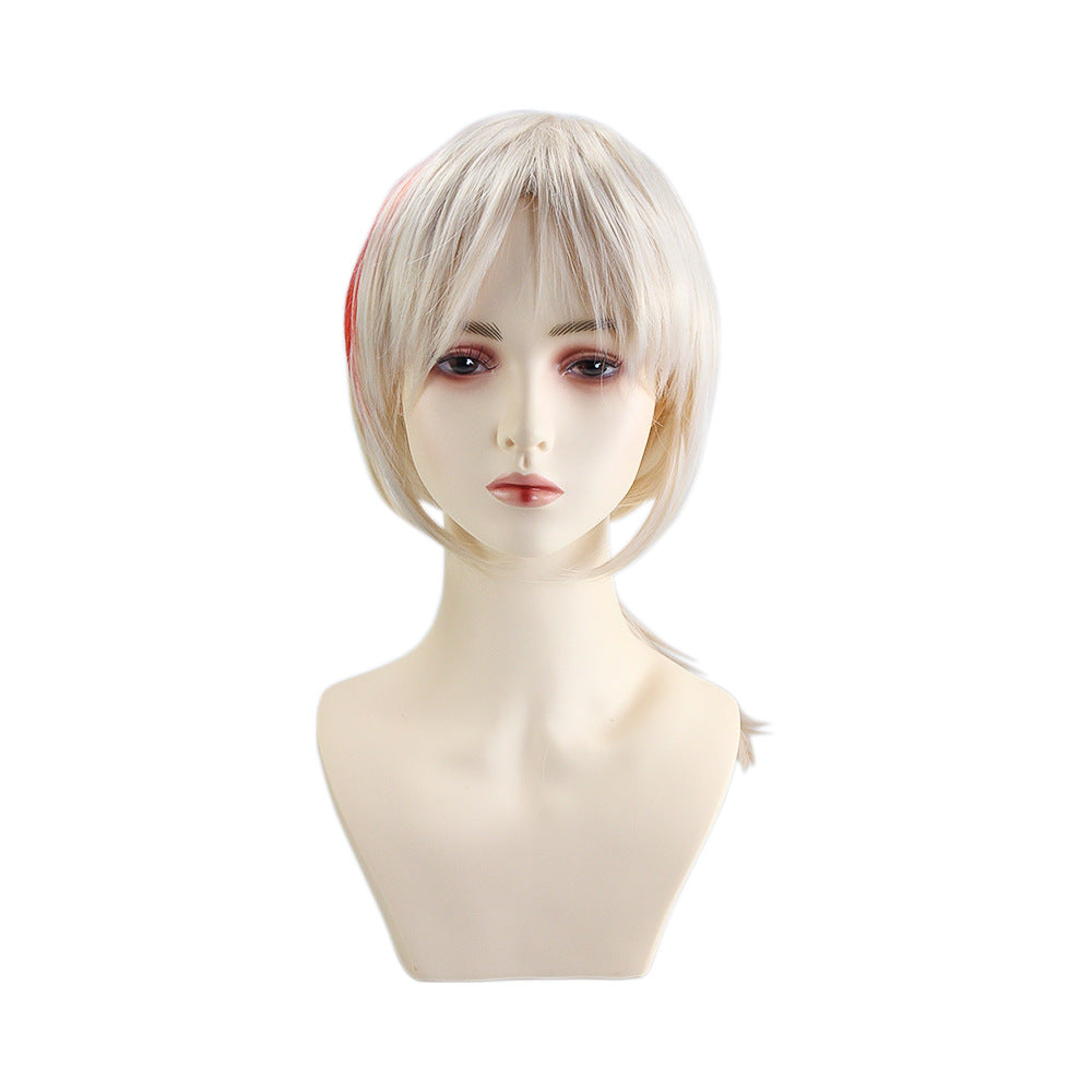 Neutral-toned mannequin head wearing a short, straight blonde wig with bangs. The wig features a subtle red streak on one side. The background is plain white.