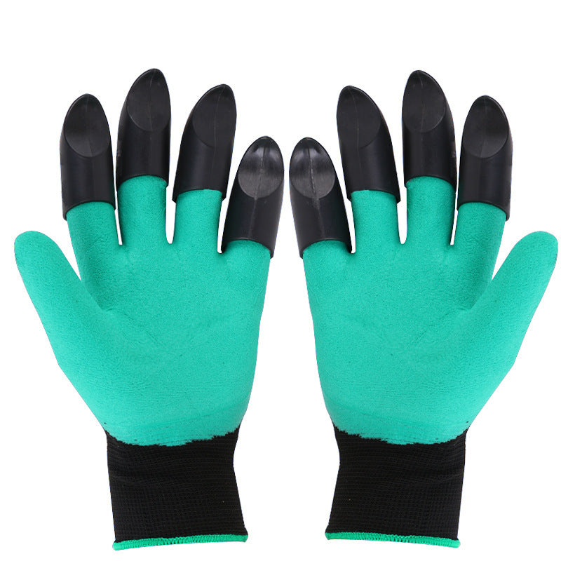 A pair of green gardening gloves with black claw-like tips on the fingers. The gloves have black wrist cuffs, designed for digging and planting in the garden.