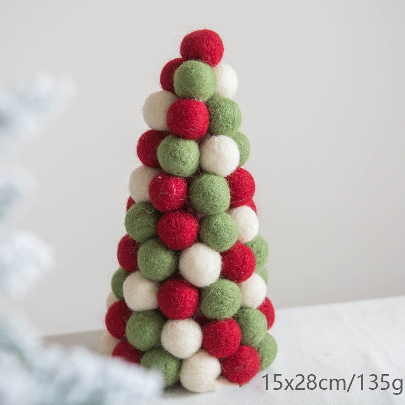 A cone-shaped Christmas tree made of red, green, and white felt balls. The dimensions and weight are noted as 15x28cm and 135g, respectively.