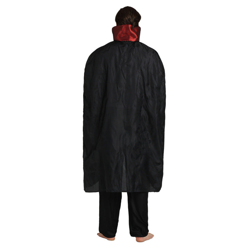 Person in a black cloak with a red collar, seen from behind, standing barefoot.