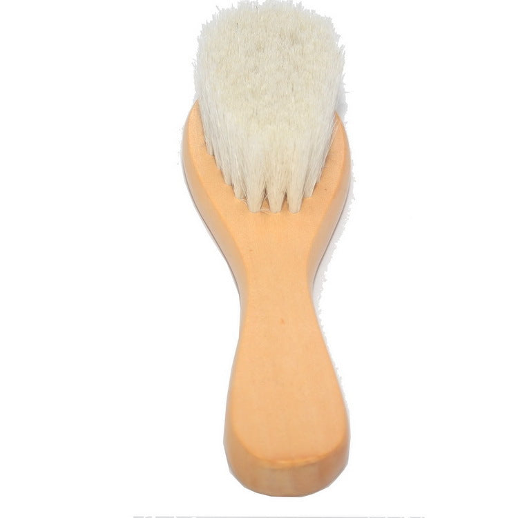Wooden body brush with white bristles, featuring an ergonomic handle, isolated on a white background. Perfect for skincare or cleaning use.