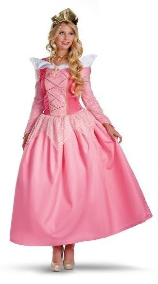 Woman in a pink ball gown with white accents and a golden crown. She has long blonde hair with curls and wears white high heels, standing against a plain white background.