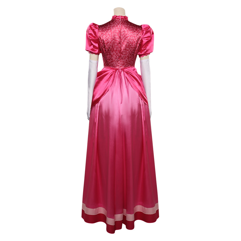 Rear view of a pink satin gown with short puffed sleeves, intricate lace on the bodice, and a full-length flowing skirt. The mannequin wears long white gloves.