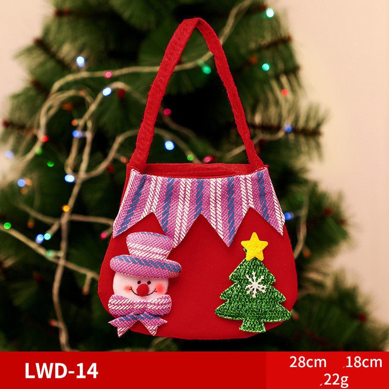 A festive red bag with a snowman and Christmas tree decorations, displayed in front of a lit Christmas tree. Dimensions shown: 28cm x 18cm, weighing 22g.