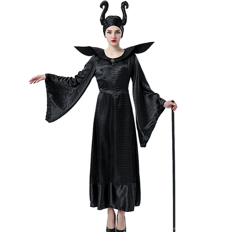 Woman in a black gown with dramatic sleeves and horned headpiece, resembling a dark fairy tale character. She holds a black staff, exuding an elegant yet intimidating presence.