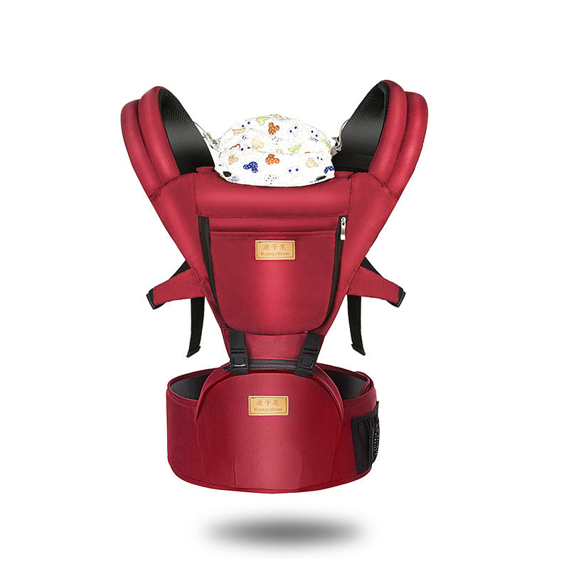 Red baby carrier with padded shoulder straps and waist support, featuring a small pocket and a floral seat lining.