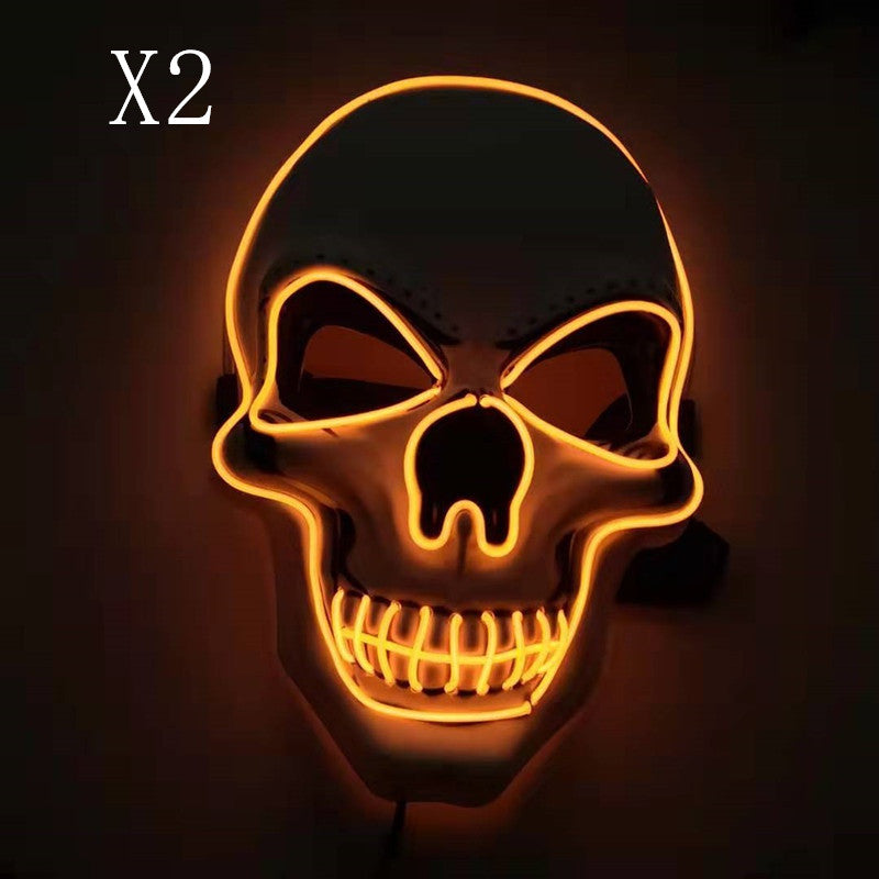 Glowing skull mask outlined in orange neon against a dark background with "X2" in the upper left corner, highlighting its striking, spooky design.