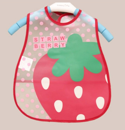 Colorful children's bib with a large strawberry design and the word "STRAWBERRY" in pink. The background is pink with white polka dots. Red trim and blue hanger included.