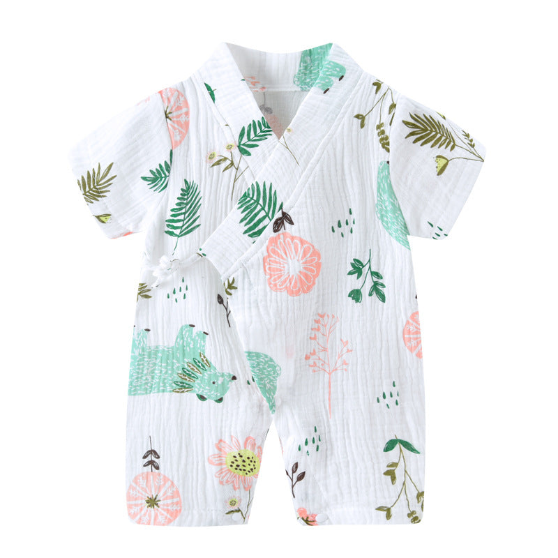 White baby romper with short sleeves, featuring a wrap-style front. Decorated with green leaves and pink florals. Made of lightweight, textured fabric.