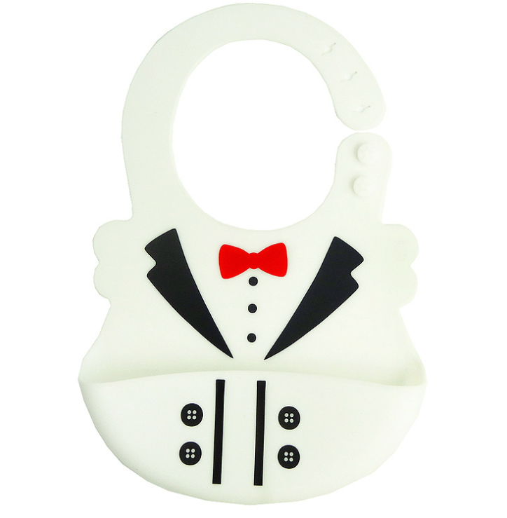 White silicone bib designed like a tuxedo, featuring black lapels, buttons, and a red bow tie, with an adjustable neck strap.