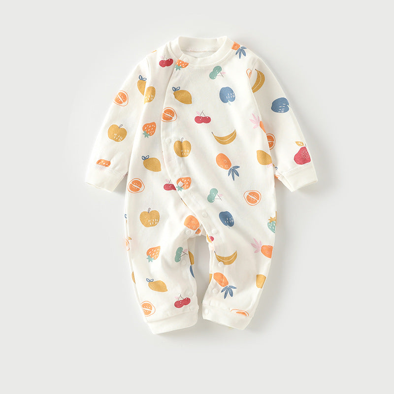 White baby onesie featuring a colorful fruit pattern, including apples, strawberries, bananas, and oranges. The long-sleeve jumpsuit is buttoned down the front.