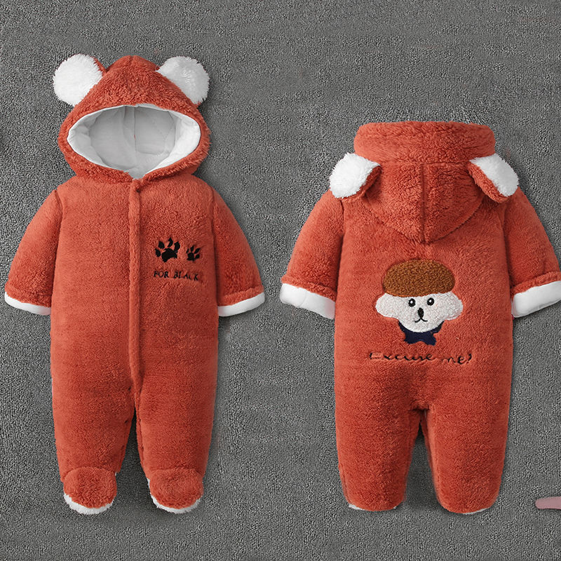 Rust-colored baby onesie with bear ears and white lining. Front features paw prints and "FOR BEAR," while the back has an embroidered cartoon face with "excuse me!" text.