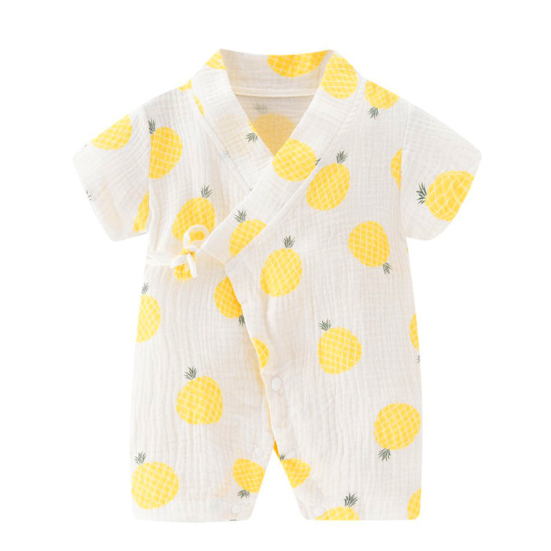 White infant romper with short sleeves, adorned with a pattern of yellow pineapples. Features a wrap-style front with a side knot. Made from soft, textured fabric.