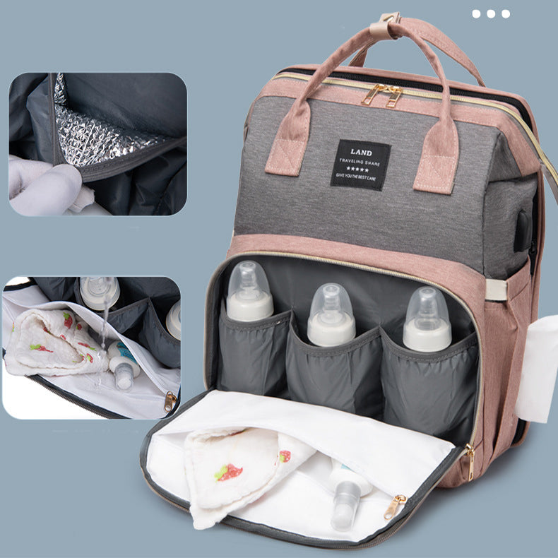 Diaper bag with insulated bottle pockets and organized compartments. The main section holds baby supplies, while smaller images highlight insulation and inner storage features.