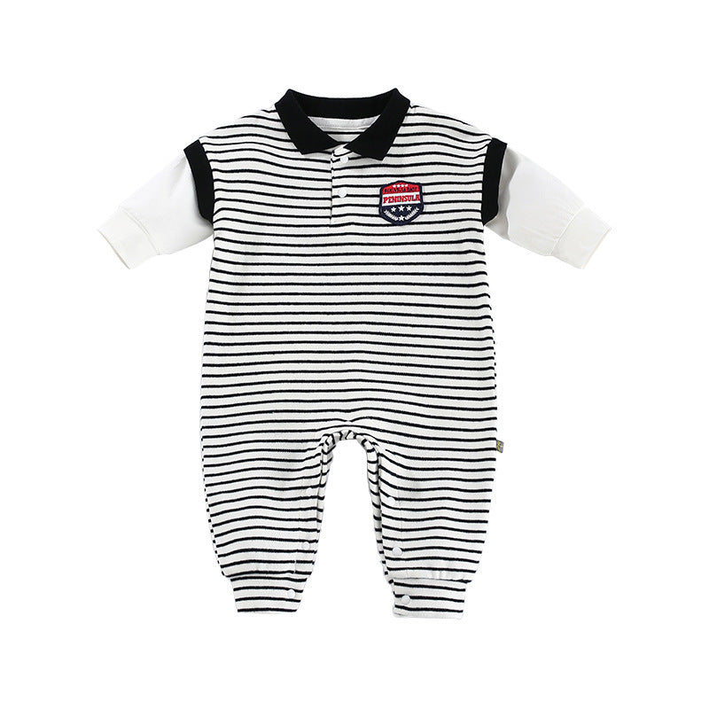 Striped baby romper with black and white horizontal lines, featuring a black collar and sleeves, and a small embroidered patch on the chest.