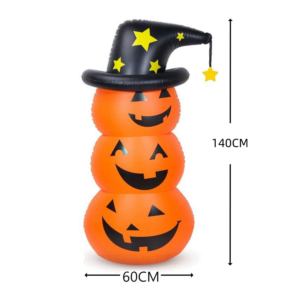 Inflatable stack of three orange jack-o'-lanterns, 140cm tall and 60cm wide, topped with a black witch hat adorned with yellow stars.