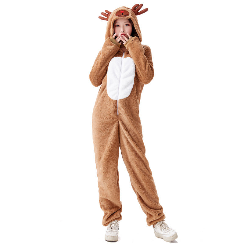 Person in a plush reindeer onesie with antler hood, covering mouth with hands. The outfit is brown with a white belly patch, paired with white sneakers.