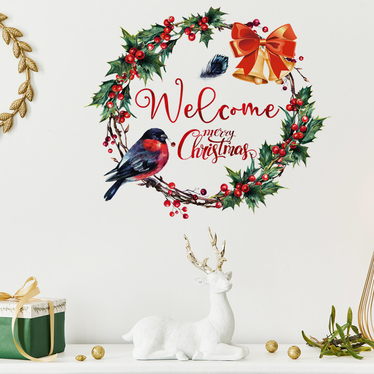 Festive wreath with holly, red berries, and a bow encircles "Welcome Merry Christmas" text, alongside a colorful bird. Nearby are a white deer figurine and gift box.